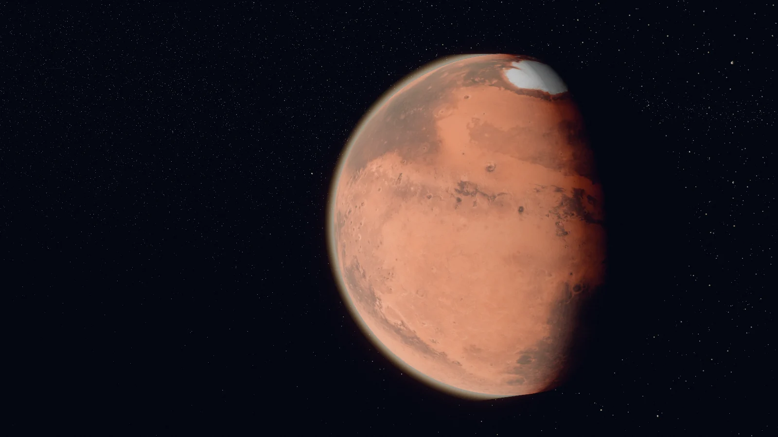 Mars, nearly full: rust-coloured plains, darker markings and a bright white polar cap at the top, with a thin haze along its edge and shadow creeping in on the right.